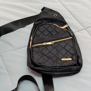 Elegant Black Quilted Crossbody Bag with Gold Accents